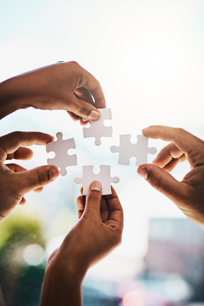 Community members working together on solar project showing collaboration and teamwork